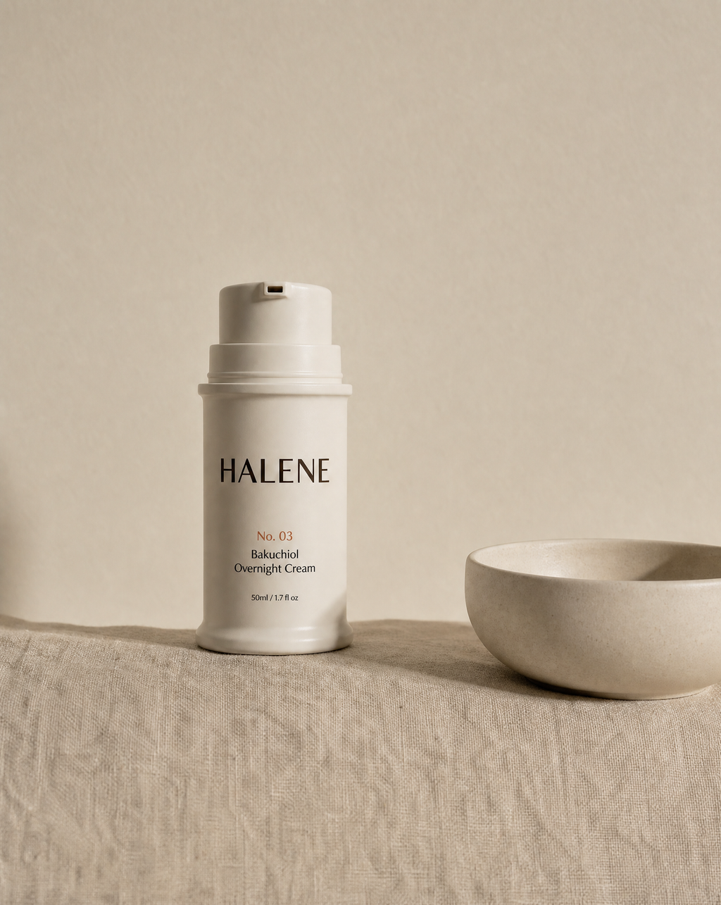 HALENE No. 03 Bakuchiol Overnight Cream on linen beside a ceramic bowl