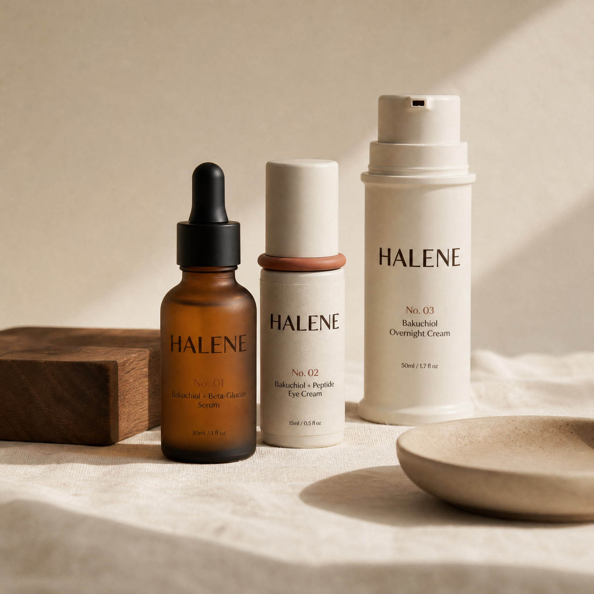 HALENE The Routine, all three bakuchiol bottles grouped on natural linen