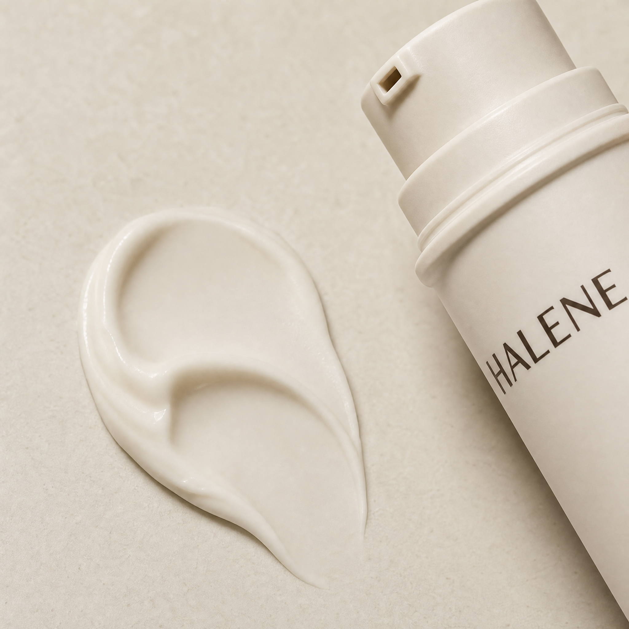 HALENE No. 03 overnight cream texture, a soft swirl on a stone tile